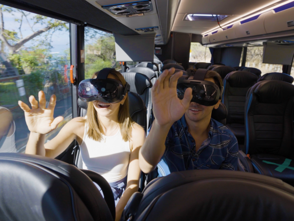a group of people sitting at a train station
