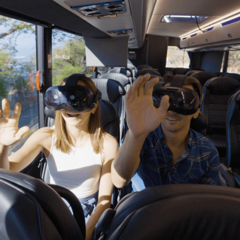 a group of people sitting at a train station